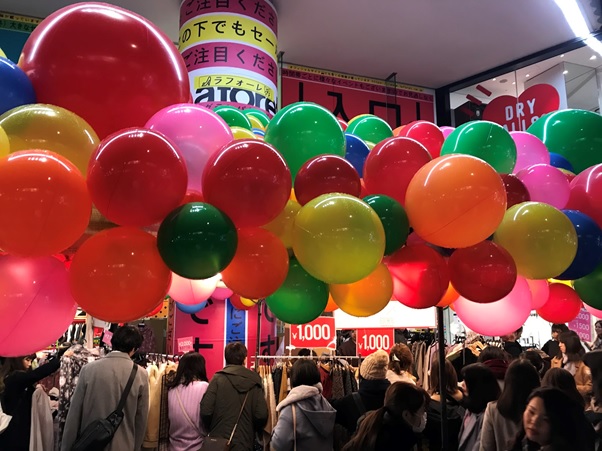 Long line in Front of Laforet  with decoration.